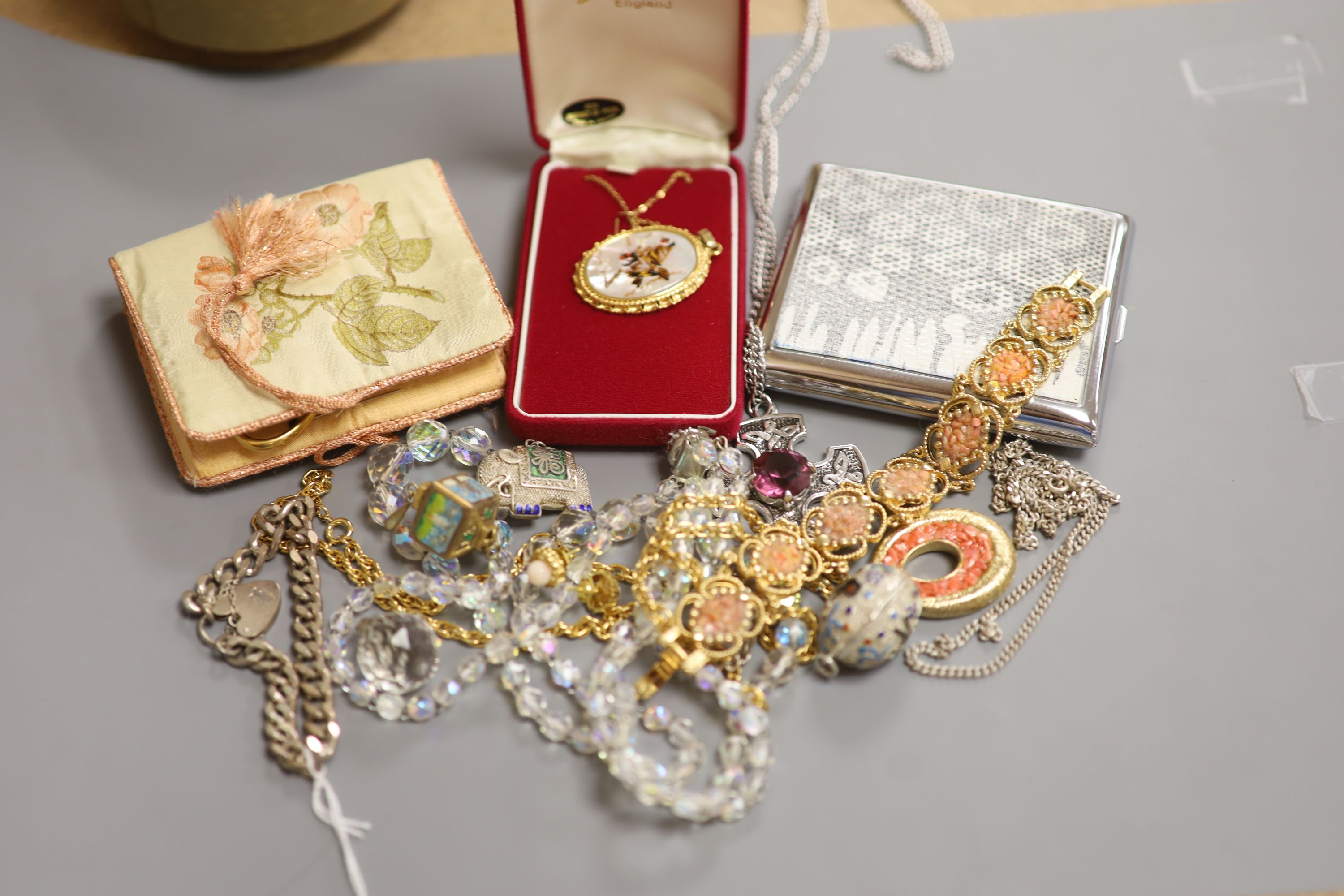Mixed jewellery including silver bracelet, costume jewellery and a cigarette case.